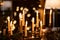 Burning candles in candlesticks in a dark interior. romantic dinner. New Year