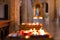 Burning candles in the Cathedral of Santa Maria Assunta in Todi, Umbria, Italy. Selective focus. Bokeh.