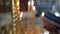 burning candles in the church candlesticks. Christian worship.