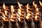 Burning candles light background.Candle flame at night Texture of Candle in Buddhism