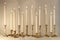 Burning candles in retro candlesticks indoor