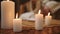 Burning candles in Spa salon close up, in the background out of focus woman in Bathrobe.