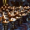 Burning candles in Tibetan Buddhist temple. Himachal Pradesh, India, Buddhist floating colorful Candle floating on water for pray