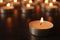 Burning candles on wooden table, space for text. Symbol of
