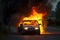 Burning car. An automobile engulfed in flames, a dangerous and chaotic scene that can have devastating consequences