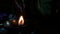 A burning clay lamp`s flame or blaze in dark background at night HD footage