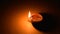 Burning clay oil lamp isolated