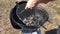 Burning coals and wood on a grill grate. Preparation of coal for barbecue