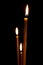 Burning in the dark taper candles