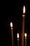 Burning in the dark taper candles