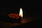 Burning diya in dark night in diwali