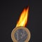 Burning euro coin