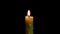 Burning and extinguishing candles. Isolated candle burning with dark background.