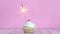 Burning fire candle on testy sweet cup cake with white cream