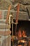 Burning Fireplace with Iron Metal Brass Tong and Tools