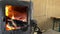 burning firewood in a potbelly stove.flaming fire in a wood-burning stove retro