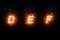 Burning font d, e, f, fire word text with flame and smoke on black background, concept of fire heat alphabet decoration