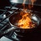 Burning food in a frying pan close-up, fire in the kitchen, disaster, emergency,