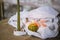 burning green candles for Halloween, evening atmosphere of a cozy house on memorial day, a pumpkin-shaped candle on a knitted