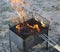 Burning grill. on brazier with hot coals is a grill. black charcoal burns and smoldering