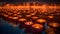 Burning hundreds, red, orange, candles on a sheet of water in the background contours of the city of houses. Diwali, the dipawali