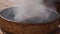 Burning incense in cauldron near Buddhist Stupa