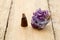 Burning incense cone with amethyst crystal with wafting smoke on