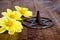Burning incense in metal pentagram with yellow dahlia flowers on