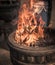 Burning incense sticks in an old stone pot at Sacred Sri Maha Bhodi Gardens close-up shot