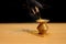 Burning incense sticks, reed diffuser with black detail label on a wooden table