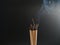 Burning incense white smoke black background used as a worship background image a sacred object of Buddhist beliefs focus on the