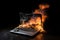 A burning laptop in a dark environment.