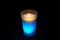 Burning light blue candle