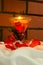 Burning love candle on white cloth