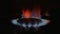 Burning natural gas in dark, shift from defocus to focused shot