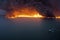 Burning Oil Spill, Huge Fire and Thick And Dense Smoke over an Oil Spill in the Sea