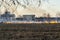 Burning old, dry grass field in the spring, Firefighters work