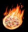 Burning pizza ingredients in flames on the black background