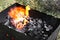 The burning process, open fire, flame, hot coals in the grill for cooking, place for barbecue