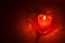 Burning red candle heart