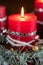 Burning red Christmas candle