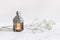Burning silver vintage Moroccan, Arabic lantern. White gypsophila, babys breath flowers on marble table background