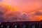 `Burning` sky over house roof at sunset