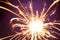 Burning sparkler firework with lots of hot glowing embers exploding. For New Years or 4th of July celebration
