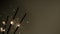 Burning sparklers on dark golden background. Super slow motion.