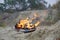 Burning sports sneakers or gym shoes on fire stand on sandy beach coast. Athlete burned out. Physical exertion during training