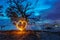 Burning steel wool under mangrove tree in heart shape