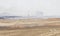 Burning stubble on an old wheat field with heavy smoke.