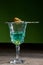 Burning sugar on spoon in glass of absinthe