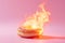 Burning sweet donut, doughnut on fire. Hot baked roll in flames, junk food, burning calories, weight loss and healthy diet concept